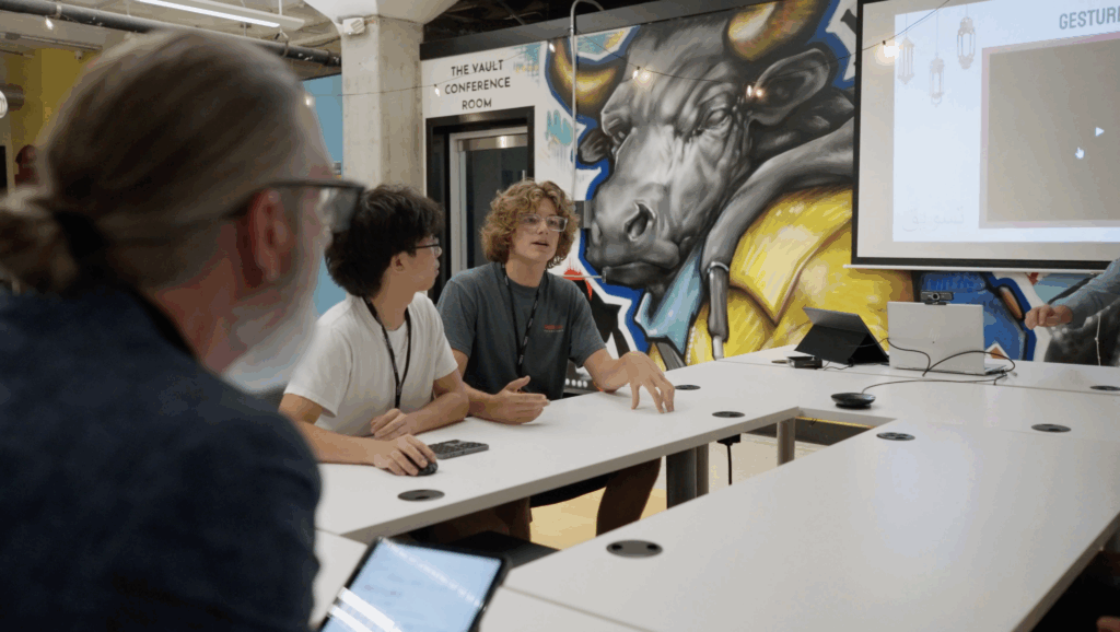 Two students and business partner participate in a Teamship session.